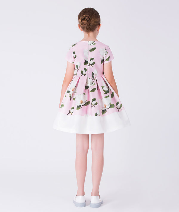 Back view of Mama Luma Petal Pink floral girls dress featuring an elegant A-line silhouette and flowing skirt, designed for flower girl moments and family gatherings, available in sizes 3–12