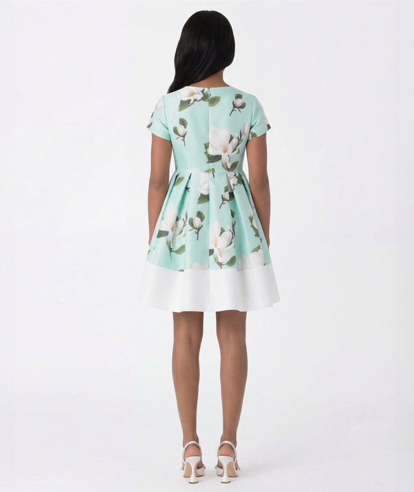 Woman wearing a floral dress with a white background