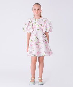 Front view of a balloon sleeve floral girls dress by Mama Luma, designed for special occasions and celebrations. Elegant silhouette for girls ages 3–12.
