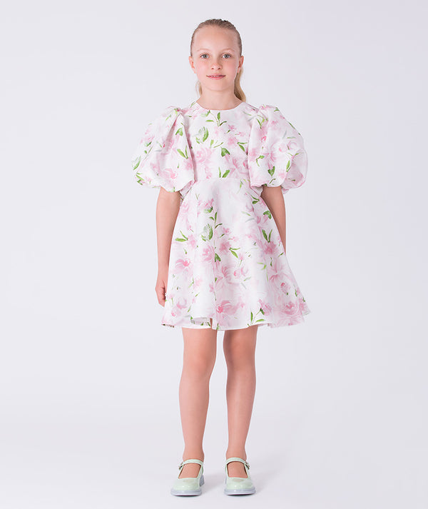 Front view of a balloon sleeve floral girls dress by Mama Luma, designed for special occasions and celebrations. Elegant silhouette for girls ages 3–12.