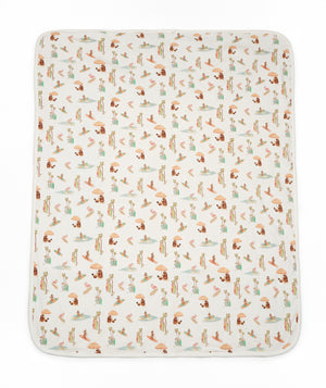 Patterned blanket with animal illustrations on a white background