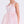 Load image into Gallery viewer, Pink dress with a bow detail on a white background
