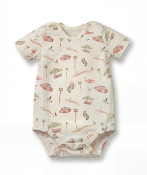Baby onesie with nature-themed print on a white background
