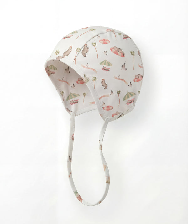 Baby bonnet with floral pattern on a white background