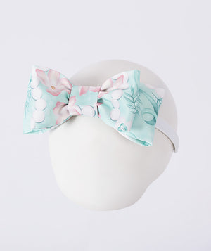 Floral patterned headband on a mannequin head with a white background
