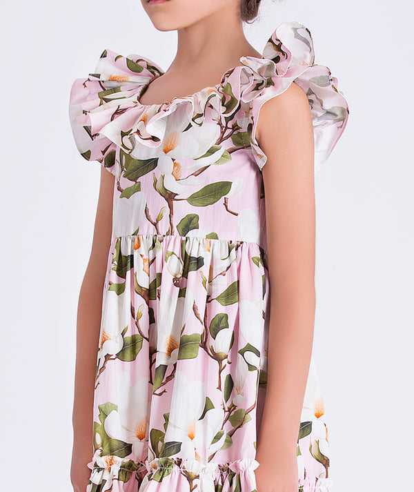 Close-up of Mama Luma girls floral dress highlighting the ruffled neckline, smooth fabric texture, and floral pattern, designed for elegant events, sizes 3–12
