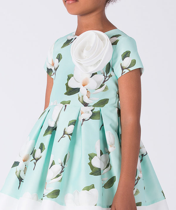 Close-up of Mama Luma girls floral dress highlighting the delicate botanical print, premium cotton fabric, and refined craftsmanship, ideal for parties and celebrations, available in sizes 3–12