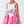 Load image into Gallery viewer, Pink dress with a silver bow on a white background
