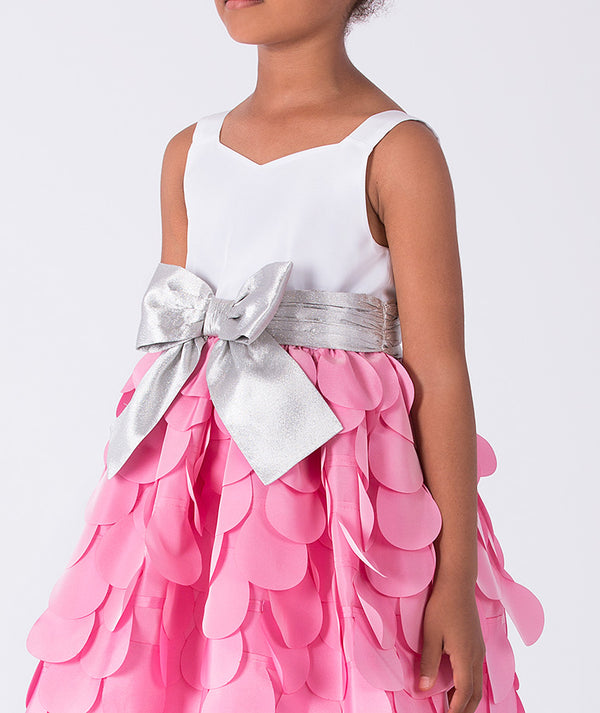 Pink dress with a silver bow on a white background