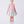 Load image into Gallery viewer, 7 years old girl wearing a pink top and silver skirt with matching shoes on a white background
