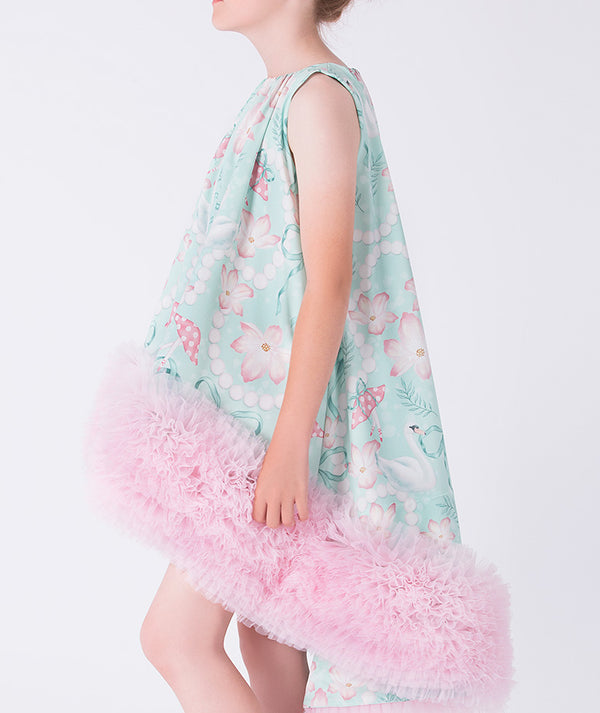 Pastel floral dress with pink ruffled bottom on a white background