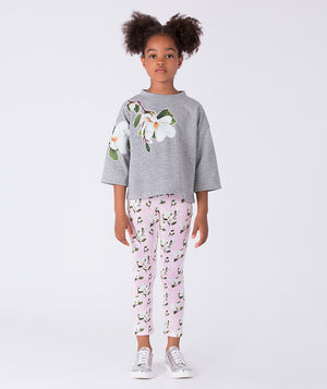 Front view of floral print girls leggings by Mama Luma, soft stretch leggings with pastel floral pattern for everyday wear