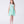 Load image into Gallery viewer, 6 years old Young girl wearing a light green dress on a white background
