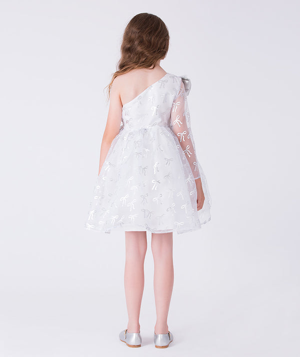 8 years old girl wearing a white floral dress with sheer sleeves on a white background