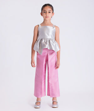 4 years old girl wearing a white top and pink pants on a white background