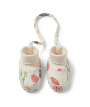 Pair of baby booties with floral design on a white background