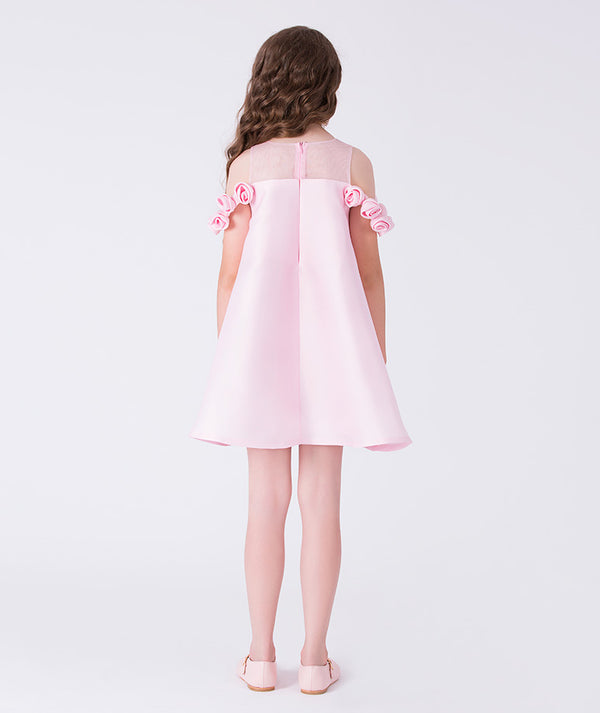 Pink dress with floral details on a white background