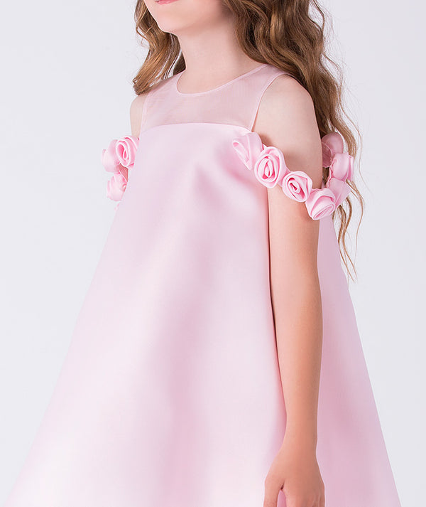 Pink dress with floral shoulder details on a white background