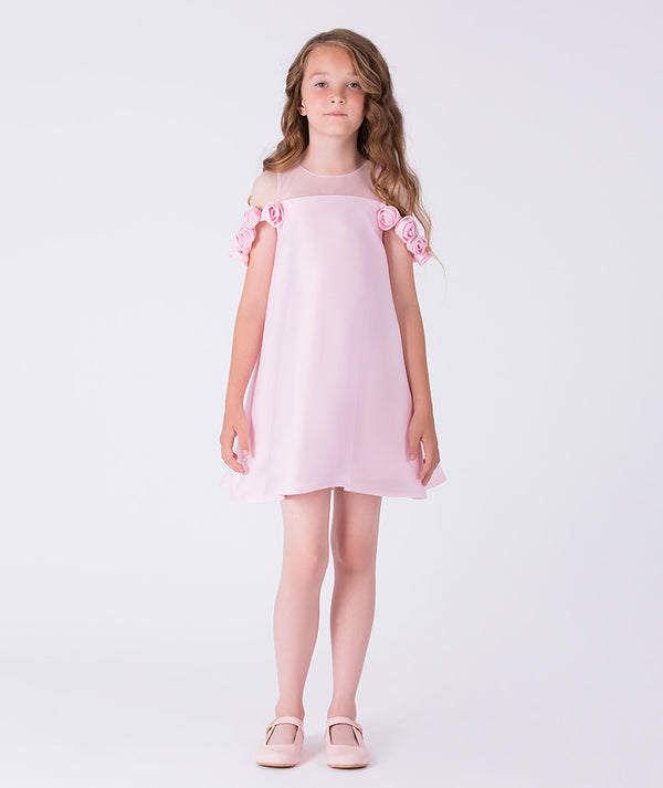 6 years old girl wearing pink dress with flower details