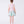 Charger l'image dans la galerie, Young girl wearing a light pink top and floral skirt on a white background
