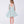 Load image into Gallery viewer, 6 years old Girl wearing a light blue floral dress on a white background
