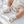 Carica l'immagine nel visualizzatore Galleria, Baby booties in a product photograph, soft infant footwear.
