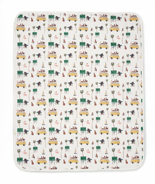 Patterned blanket with vehicles and nature elements on a white background