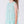 Load image into Gallery viewer, Light blue sequin dress worn by an 8 years old girl on a white background
