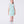Load image into Gallery viewer, 8 years old girl wearing a light blue dress with white polka dots on a white background
