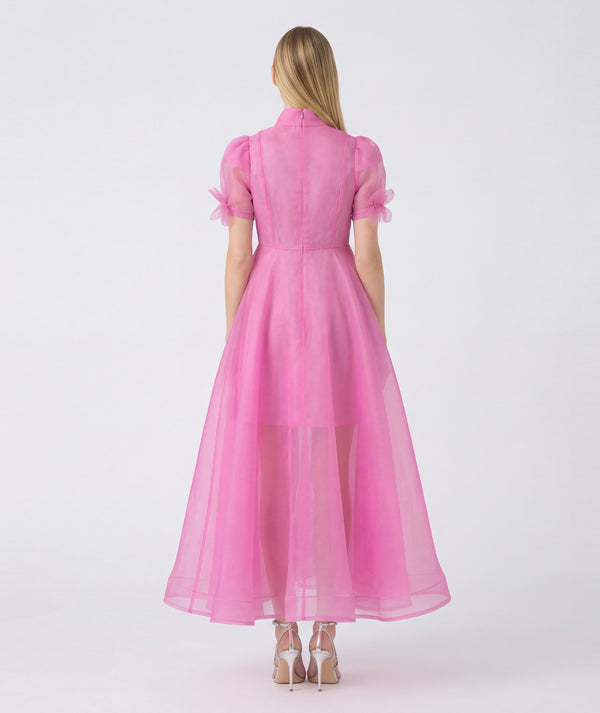 Pink dress with short sleeves and a high neckline on a white background