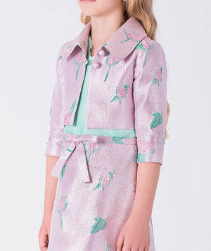 6 YEARS OLD wearing a pink floral dress with a white background