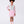 Load image into Gallery viewer, Young girl wearing a light blue top, pink skirt, and pink boots on a white background
