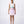 Carica l'immagine nel visualizzatore Galleria, Woman wearing a white top and pink skirt with floral details on a white background
