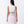 Carica l'immagine nel visualizzatore Galleria, Woman wearing a white top and pink skirt with green waistband on a white background
