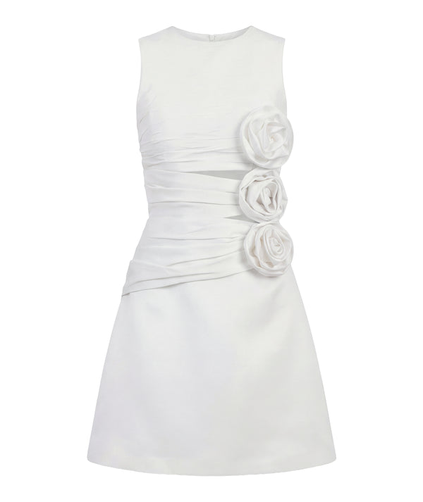 White dress with floral embellishments on a white background