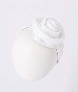 Front view of Aitana Garden White Rose Headband in white satin, showing overall silhouette and styling