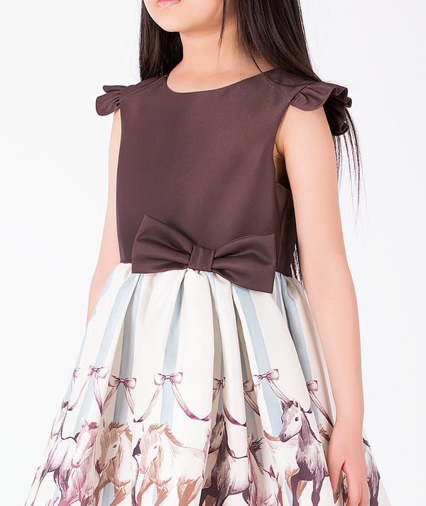 Detail view of Altai Morin Girls Bow Dress featuring a brown bodice, waist bow and equestrian horse print for girls ages 3 to 12 by Mama Luma.
