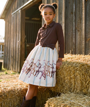 Altai Morin girls 2-piece outfit with chocolate collared top, equestrian horse print skirt and statement bow by Mama Luma.