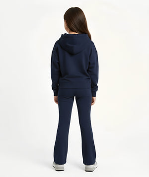 Girl seen from the back wearing a navy hoodie and matching pants, styled for everyday athleisure, school days, and active play, available in sizes 3–14