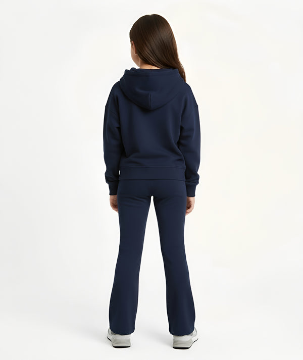 Girl seen from the back wearing a navy hoodie and matching pants, styled for everyday athleisure, school days, and active play, available in sizes 3–14