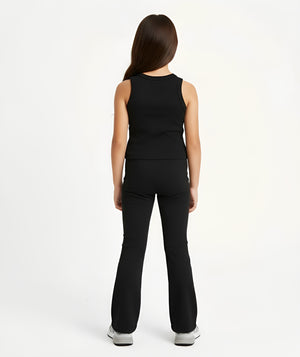 Girl styled in a black sleeveless tank top and matching ribbed pants for everyday activewear, shown from the back, available in sizes 3–14