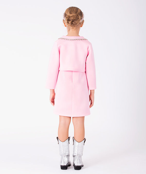 Back view of blush pink cape dress with silver boots