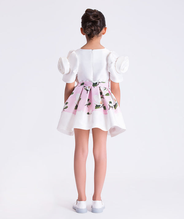 Back view of Mama Luma ivory floral girls outfit with an elegant silhouette and flared skirt, designed for flower girl moments and family gatherings, sizes 3–12