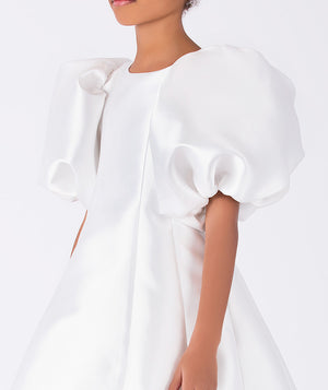Close-up of Balloon Sleeve Mikado Girls Dress in ivory for girls ages 3 to 12, highlighting fabric texture and designer details