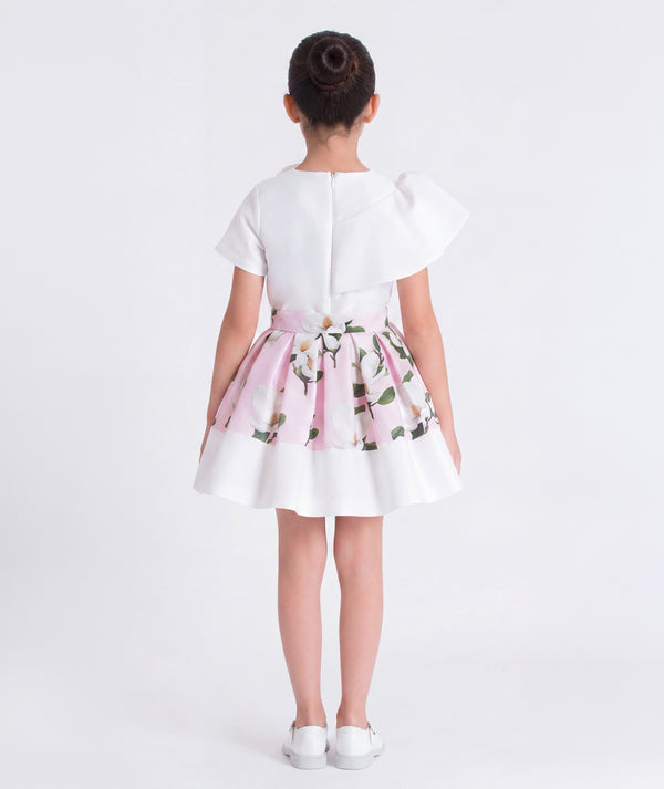 Back view of Mama Luma ivory floral girls outfit with an elegant silhouette and flared skirt, designed for flower girl moments and family gatherings, sizes 3–12