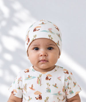 Beach-print baby beanie, soft baby headwear accessory.