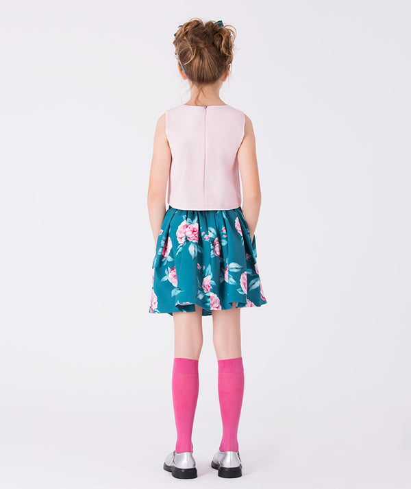 Back view of elegant blush pink blouse and teal floral skirt set for girls, showcasing soft pleats and vibrant blooms — perfect for spring events, family photos, and garden parties. Available in sizes 3–12Y