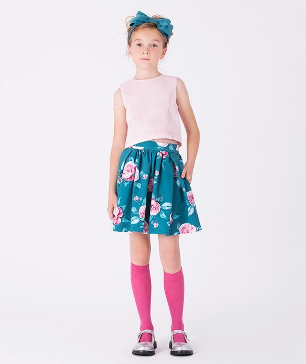 Charming blush pink top and teal floral skirt outfit for girls, styled with a matching headband — perfect for birthdays, spring celebrations, and family gatherings. Available in sizes 3–12Y