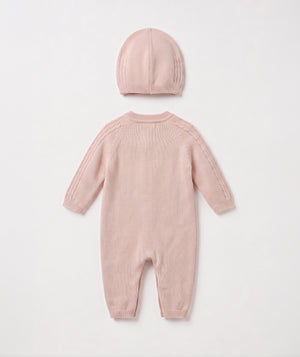 Blush cable knit baby romper with matching beanie luxury newborn knit outfit perfect for special occasions