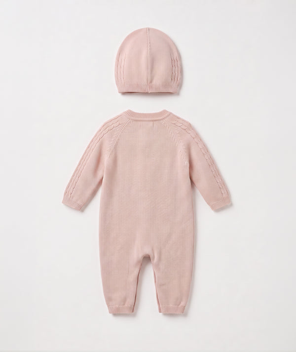 Blush cable knit baby romper with matching beanie luxury newborn knit outfit perfect for special occasions